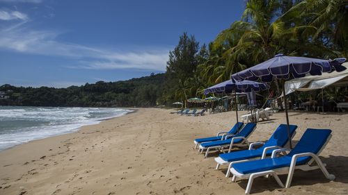 Empty lounge chairs seen on an empty Kamala Beach in Phuket, Thailand. 