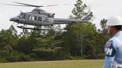 A helicopter takes off to assist in the search. (Getty Images)