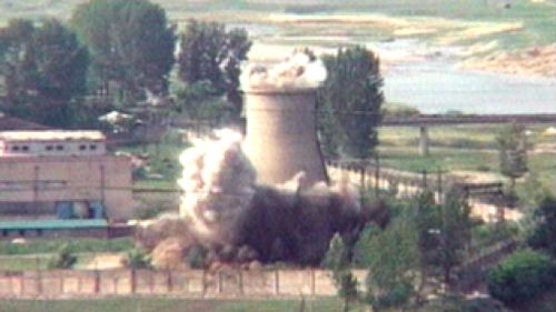 North Korea demolishes a 60-foot-tall cooling tower at its main reactor complex in Yongbyon in 2008. (AP) 