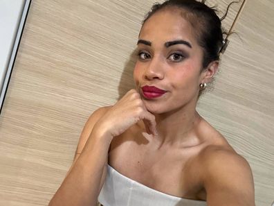 Matildas forward Mary Fowler poses in red lipstick.