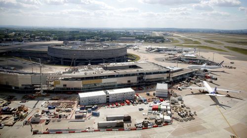 The passenger has been detained at Charles de Gaulle airport for several days.