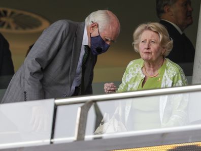 Former Prime Minister John Howard and his wife Janette, prepare to watch play after a rain delay on day one of the third cricket test between India and Australia at the Sydney Cricket Ground, Sydney, Australia, January 7, 2021. 