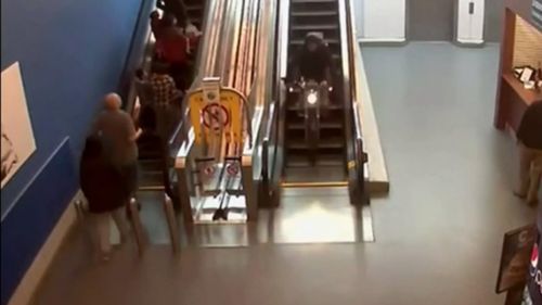 The bandit riding down the escalator. (Twitter - @dahboo7)