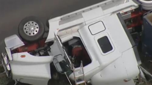 The truck driver has been taken to hospital in a stable condition. (9NEWS)