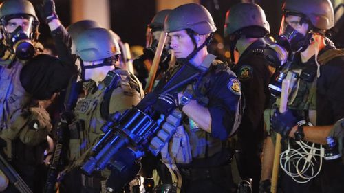 Police in Ferguson armed with tear gas grenade launchers. (Getty)