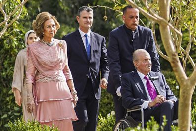 Former King of Spain Juan Carlos, in a wheelchair, and his wife Sofia arrive at the marriage ceremony of Crown Prince Hussein and Saudi architect Rajwa Alseif on Thursday, June 1, 2023, in Amman, Jordan. 