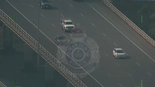 Two men who led police on a chase have been charged after they were found hiding in barrels in an abandoned shed north of Brisbane. 
