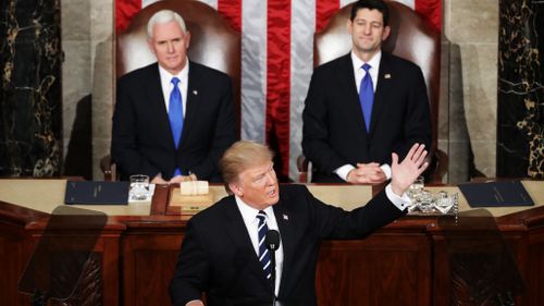 The president was flanked by Vice President Mike Pence and House Speaker Rep. Paul Ryan. (Getty Images)