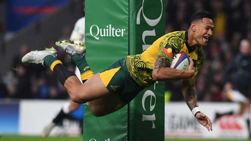 Israel Folau scores a try against England last year.