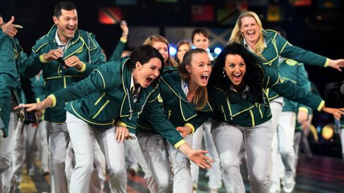 Australian athletes smile as they arrive during the Opening Ceremony for the Glasgow 2014 Commonwealth Games at Celtic Park. (Getty Images)