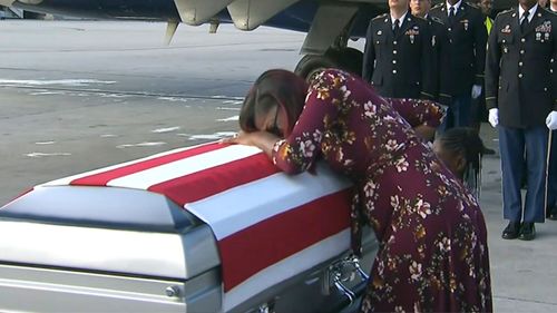 Myeshia Johnson cries over the casket of her husband, Sgt. La David Johnson, who was killed in an ambush in Niger, upon his body's arrival in Miami. (AP)