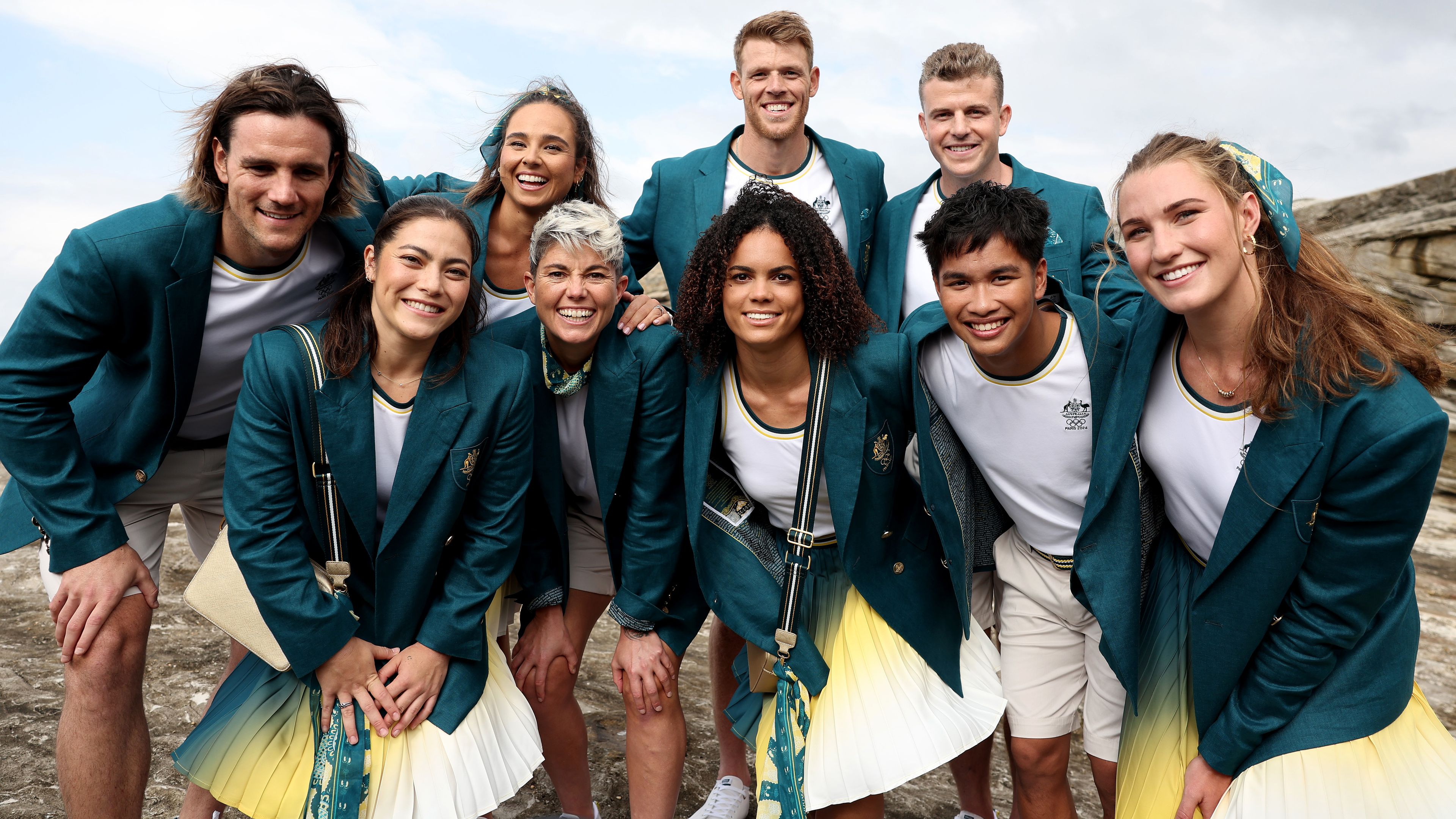 Members of the Australian Olympic team pose for media at Clovelly Surf Club.
