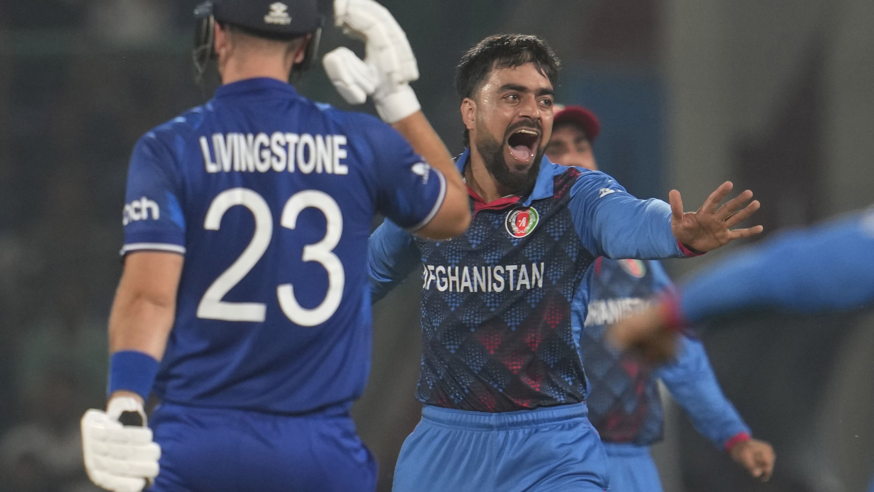 Afghanistan&#x27;s Rashid Khan celebrates the wicket of England&#x27;s Liam Livingstone.