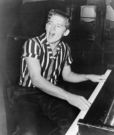 Jerry Lee Lewis, pictured singing at a piano, in 1975.