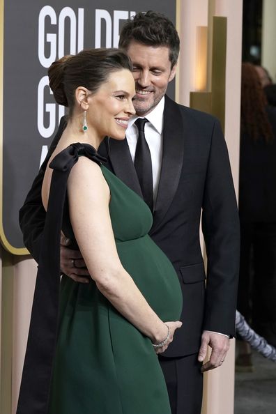 Hillary Swank, left, and Philip Schneider arrive at the 80th annual Golden Globe Awards