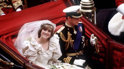 The royal couple depart in a carriage. (Getty)