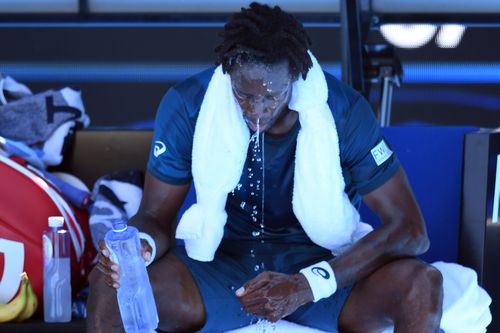 Gael Monfils of France cools down during a break in play against Novak Djokovic of Serbia during round two on day four of the Australian Open. (AAP)