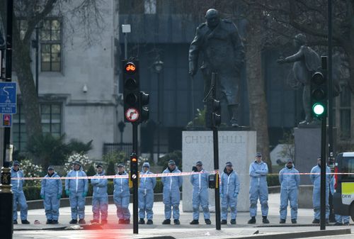 Forensic officials conduct searches in the area around the Houses of Parliament . (AAP)