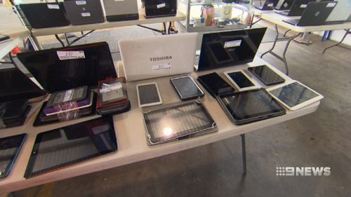 Laptops lost at Brisbane Airport will go under the hammer for charity. (9NEWS)