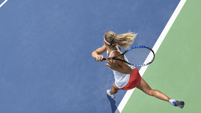 Woman playing tennis stock photo