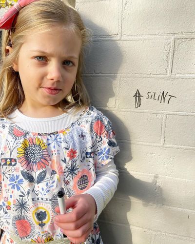 Ben Fordham's daughter Pearl flexes her spelling skills...on the front of the house.