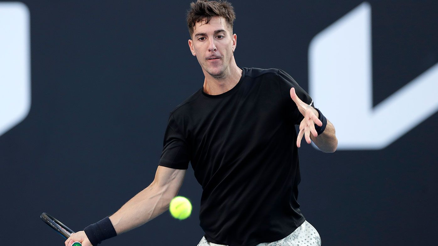 Thanasi Kokkinakis of Australia plays a forehand in his first round singles match against Yannick Hangman of Germany