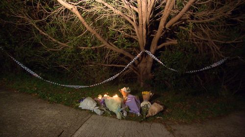 Floral tributes for the teenagers are being placed outside the home, which remains an active crime scene. Picture: 9NEWS