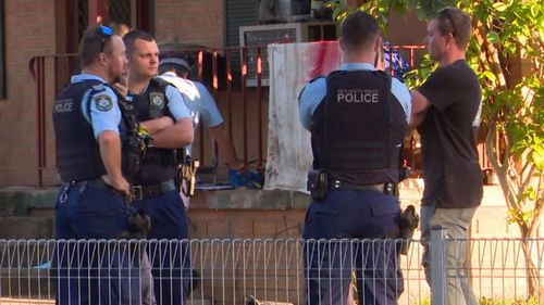 A man speaks to police after two officers were attacked.