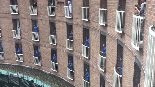 Fijian rugby players' rousing song on their balconies.