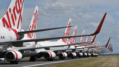 Virgin Australia jets sit idly.