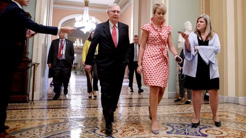 Senate Majority Leader Mitch McConnell walks to the Senate Floor in the US Capitol in Washington, DC.