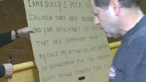 Racist ordered to hold bully sign