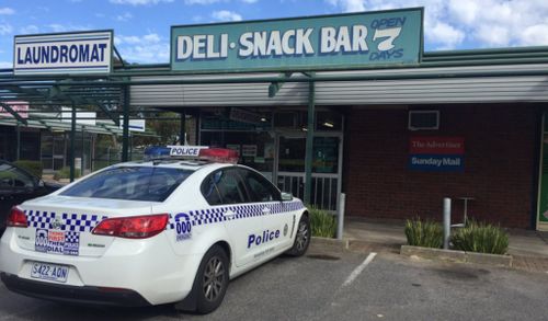 Two men armed with baseball bats on the run after deli robbery in Adelaide