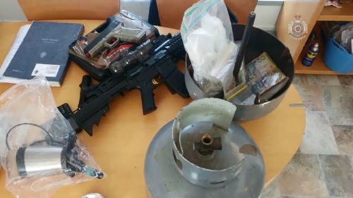 Police seized weapons, drugs and cash.