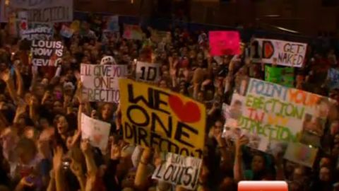 Aussie One Direction fans flash crude signs on live TV