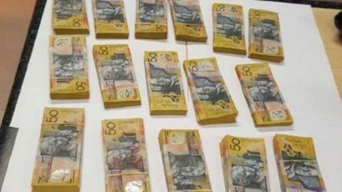 Man charged after $97k found in car following crash in central-west NSW