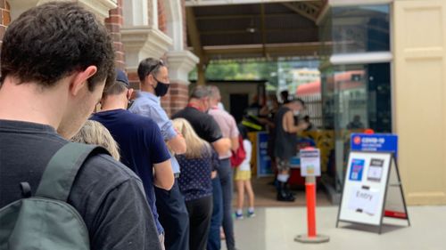 Queue at Roma Street Station in Brisbane for pop-up COVID-19 vaccination clinic.