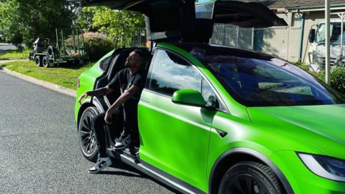 Nick Kyrgios and his bright green Tesla.