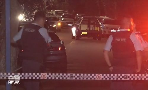 Police swarm Park Street in Campsie after a shooting.