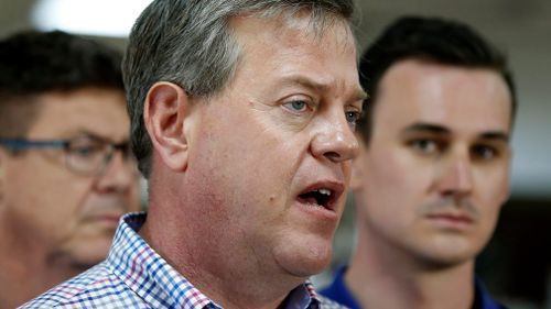 Queensland Opposition Leader Tim Nicholls, flanked by Rob Molhoek (left) and Sam O'Connor talks to media during a visit to Musgrave Hill Bowls Club, Gold Coast. (AAP)