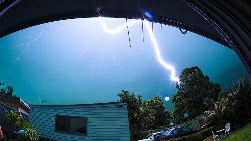A lightning bolt strikes a power pole. (Chris Dixon)