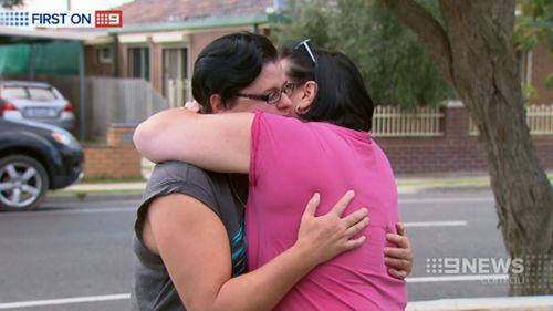 Kylie is comforted by her friend Teresa who witnessed the alleged incident. (9NEWS)