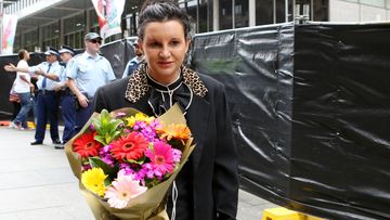 Tasmanian Senator Jacqui Lambie lays flowers at the Martin Place memorial. (AAP)