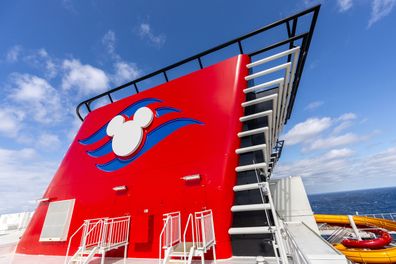 With its trademark iconic red funnels, the Disney Adventure is the newest addition to the expanding Disney Cruise Line fleet and the first for families in Asia. (Preston Mack, photographer)