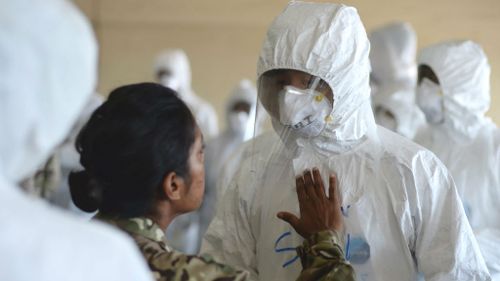 Soldiers being trained to deal with Ebola patients in Sierra Leone. (AAP)