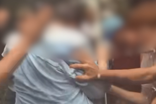 A distressed mother of a 17-year-old Scots College student has described how her son was allegedly lured to a park and forced to walk through a human tunnel while being assaulted in a "coming of age" school tradition.