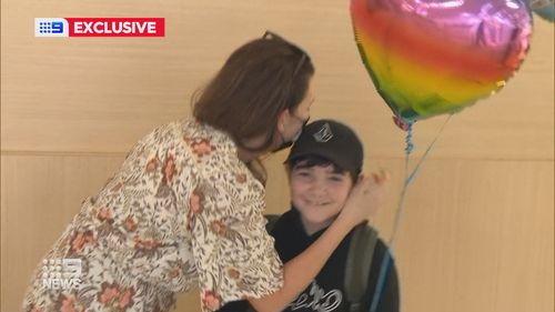 Simone Brennan and son Luchas were reunited on the Gold Coast today after 12 weeks apart.