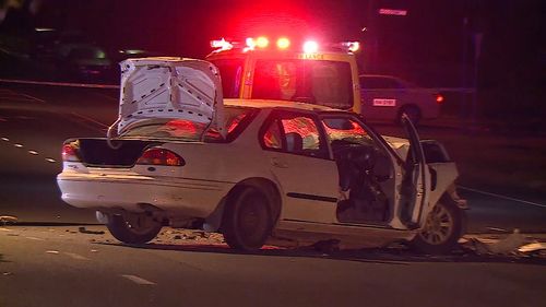 The white sedan is left mangled after colliding with a parked truck.