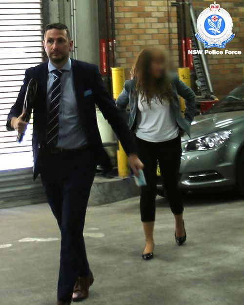 UTS Dean of Science Dianne Jolley is led away by NSW Police after her arrest on campus in November.