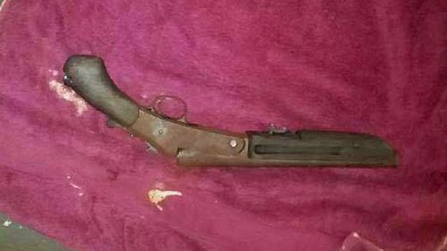 A sawn-off shotgun was found at the property.